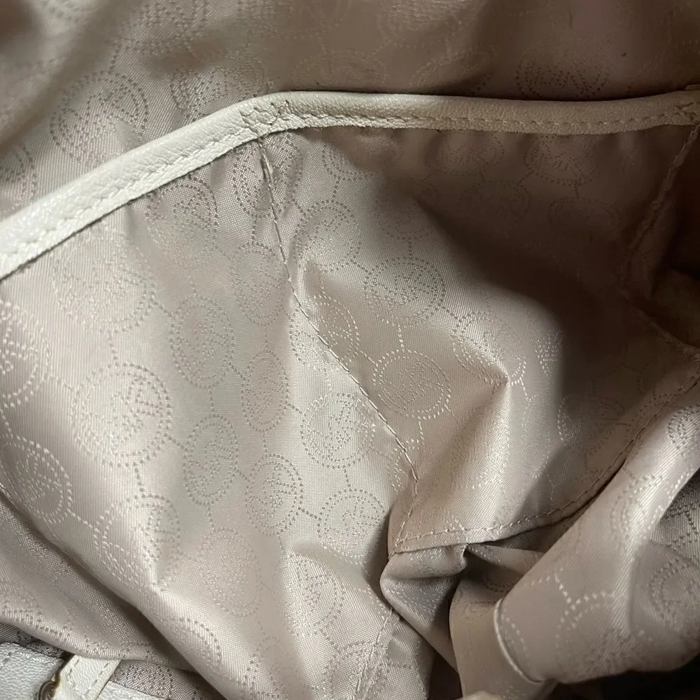 Michael Michael Kors leather beige drawstring bucket satchel.silver tone accents